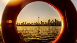 A beautiful sunset shot of a river with the city of Toronto glowing in the background