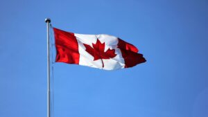 A waving Canadian flag symbolising the Cheapest provinces to live in Canada in 2026 for affordable living